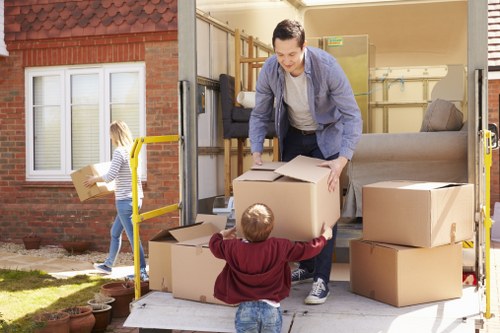 Apartment moving preparation in Pinner with packed boxes and furniture