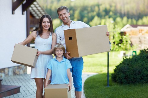 Organized furniture storage unit in Pinner with wrapped wooden furniture and packing materials