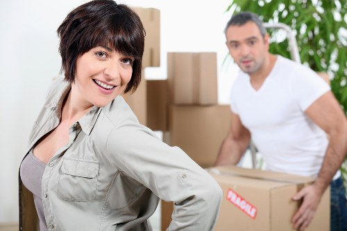 Moving team handling furniture during house removals in Pinner